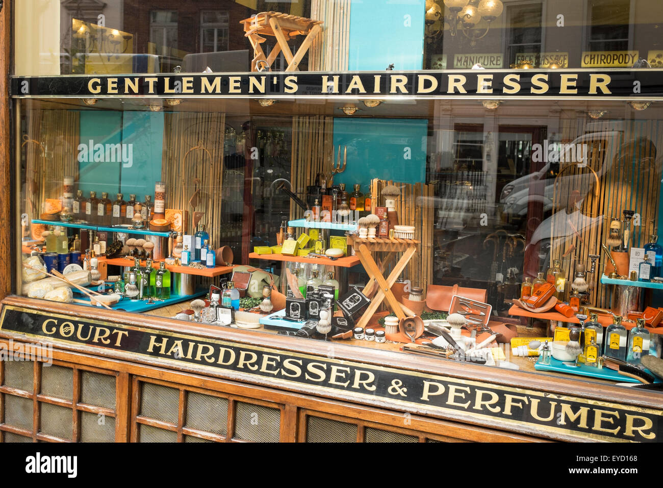 Window display by G F Trumper, a traditional barbershop, in Mayfair, London, UK Stock Photo