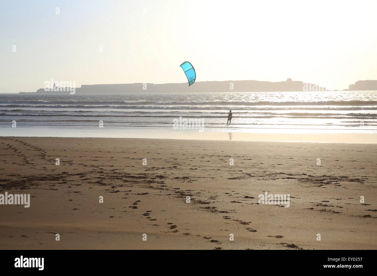 Kite surfing on Essaouira beach, with the old prison on the Island of