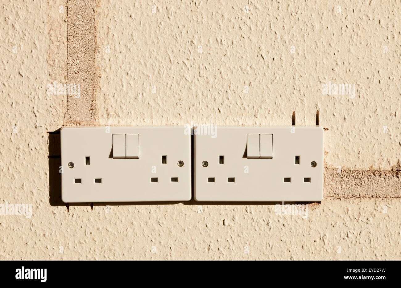 Two double electrical UK sockets, newly installed, showing how they are