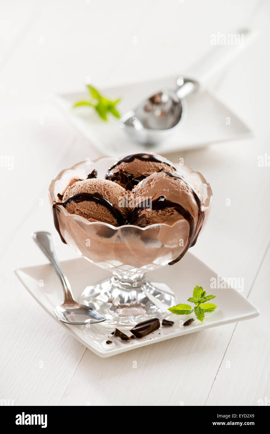Chocolate ice cream with syrup in glass Stock Photo - Alamy