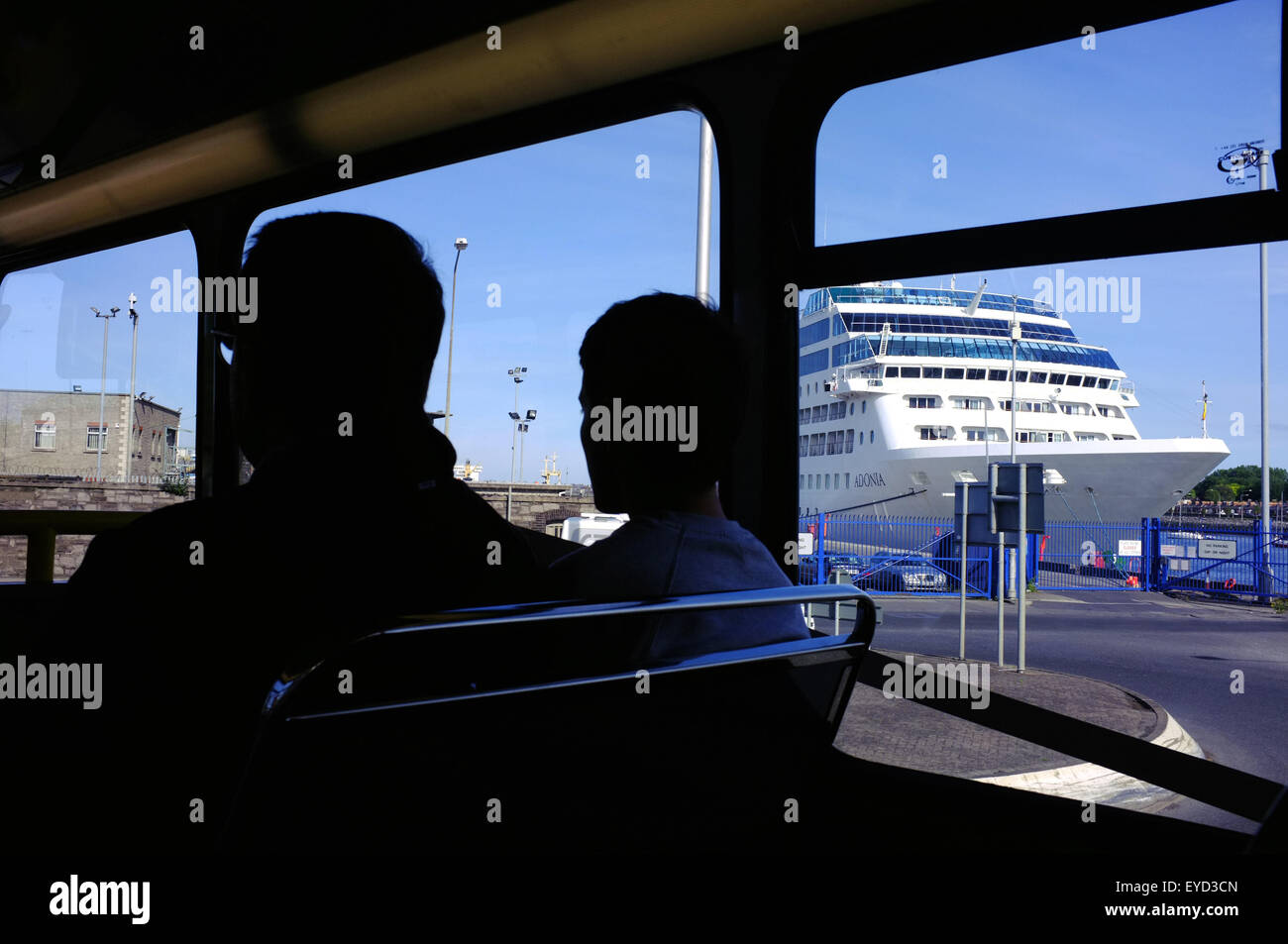 Passengers on the Dublin Airport bus pass a ferry on the journey to the airport from the city centre. Stock Photo
