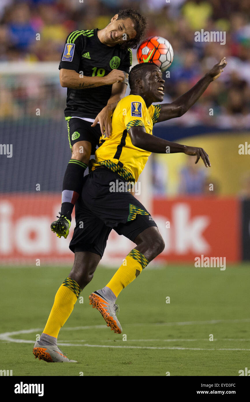 July 26, 2015: Mexico midfielder Andres Guardado (18) leaps to head the ball over Jamaica midfielder Je-Vaughn Watson (15) during the CONCACAF Gold Cup 2015 Final match between Jamaica and Mexico at Lincoln Financial Field in Philadelphia, Pennsylvania. Mexico won 3-1. Christopher Szagola/CSM Stock Photo