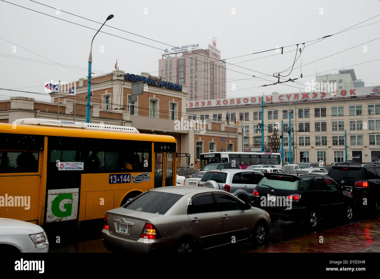 Daily traffic on Olympic Street on a snowy day in the capital city - Ulaanbaatar - Mongolia Stock Photo