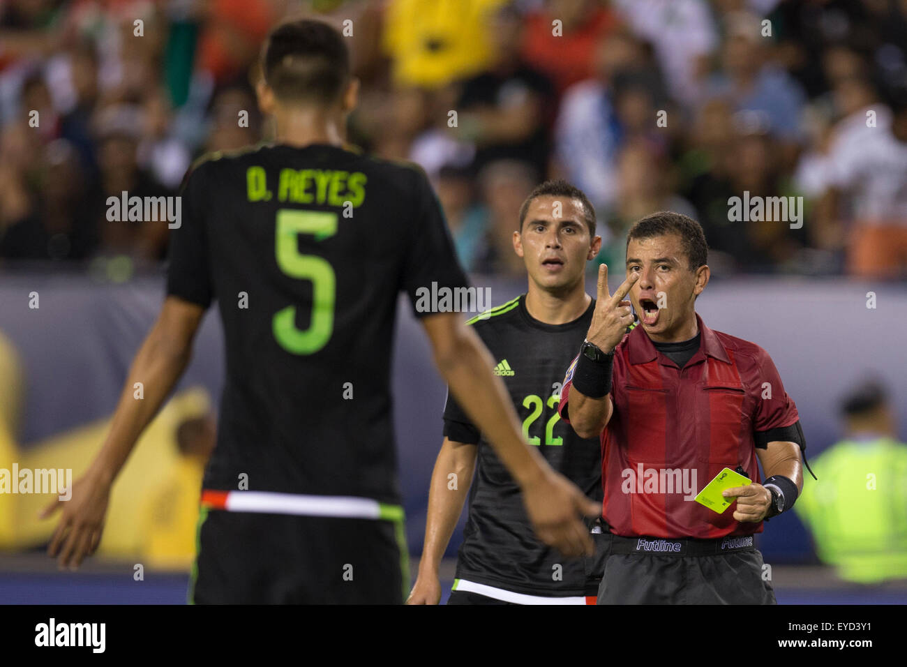 July 26, 2015: Referee Joel Aguilar talks with Mexico defender Diego Reyes (5), who is about to get a Yellow Card, with defender Paul Aguilar (22) looking on during the CONCACAF Gold Cup 2015 Final match between Jamaica and Mexico at Lincoln Financial Field in Philadelphia, Pennsylvania. Mexico won 3-1. Christopher Szagola/CSM Stock Photo