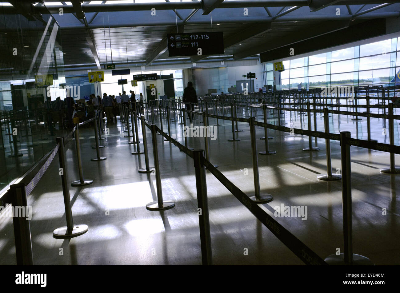 Temporary rope lanes created by stanchions in Dublin Airport directing departing passengers to different boarding gates. Stock Photo