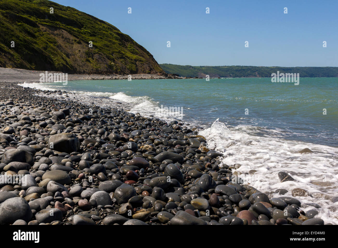 Greencliff Beach View at High Tide, Looking South West towards Bucks Mills, Devon, UK. Stock Photo