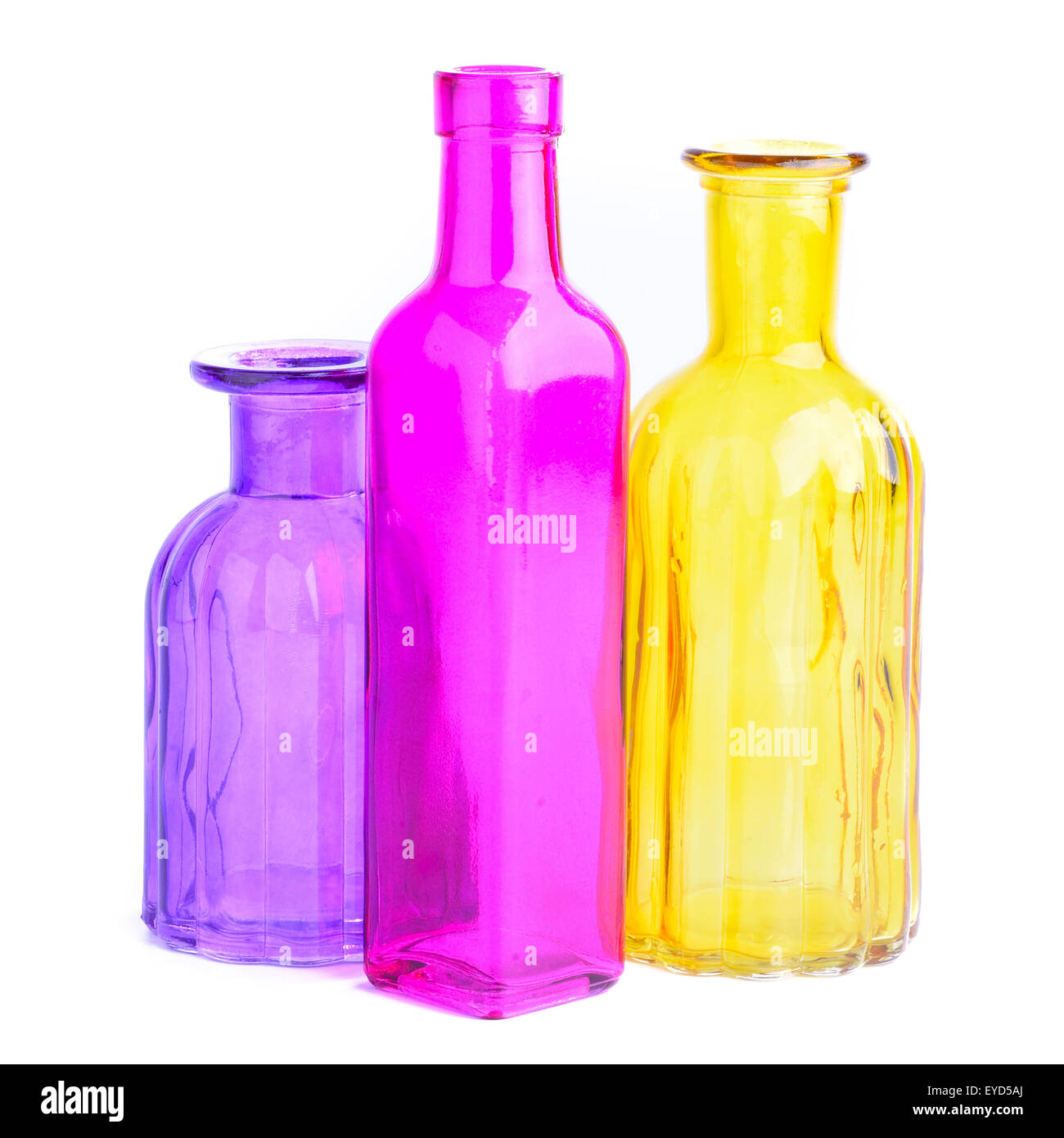 Three colorful bottles, isolated on white background Stock Photo