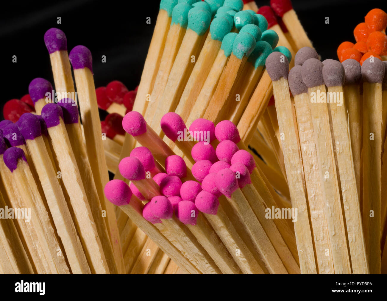 Multicoloured safety match heads. Long matches for lighting a fire. Stock Photo