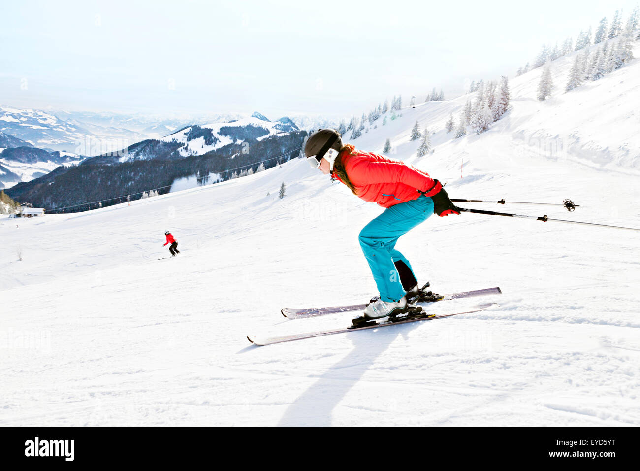 Ski holiday, Woman skiing downhill, Sudelfeld, Bavaria, Germany Stock Photo
