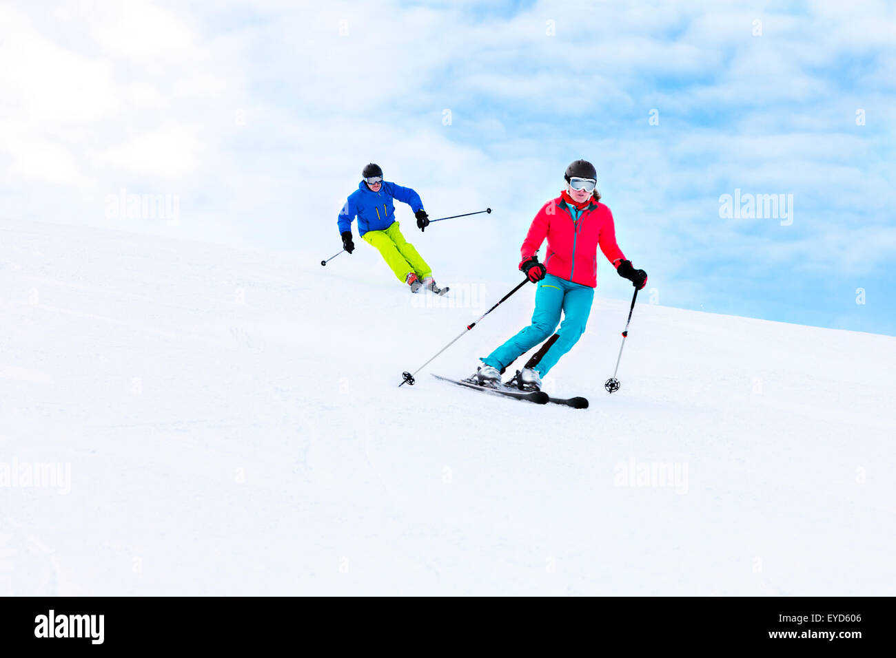 Ski holiday, Two skiers carving downhill,  Sudelfeld, Bavaria, Germany Stock Photo
