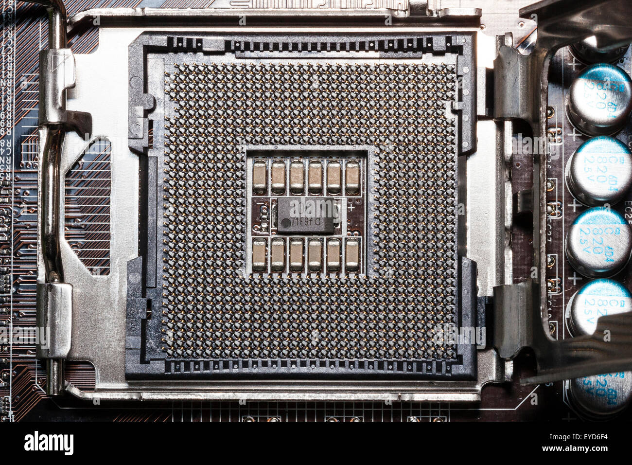 Close up of the Intel 775 processor socket on home computer motherboard without the chip in place. Pattern Stock Photo