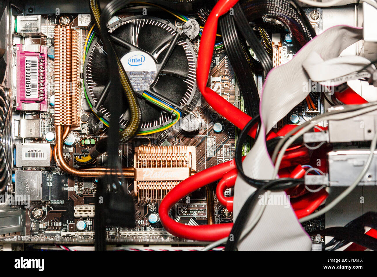 Interior of computer case with motherboard and processes fan, plus