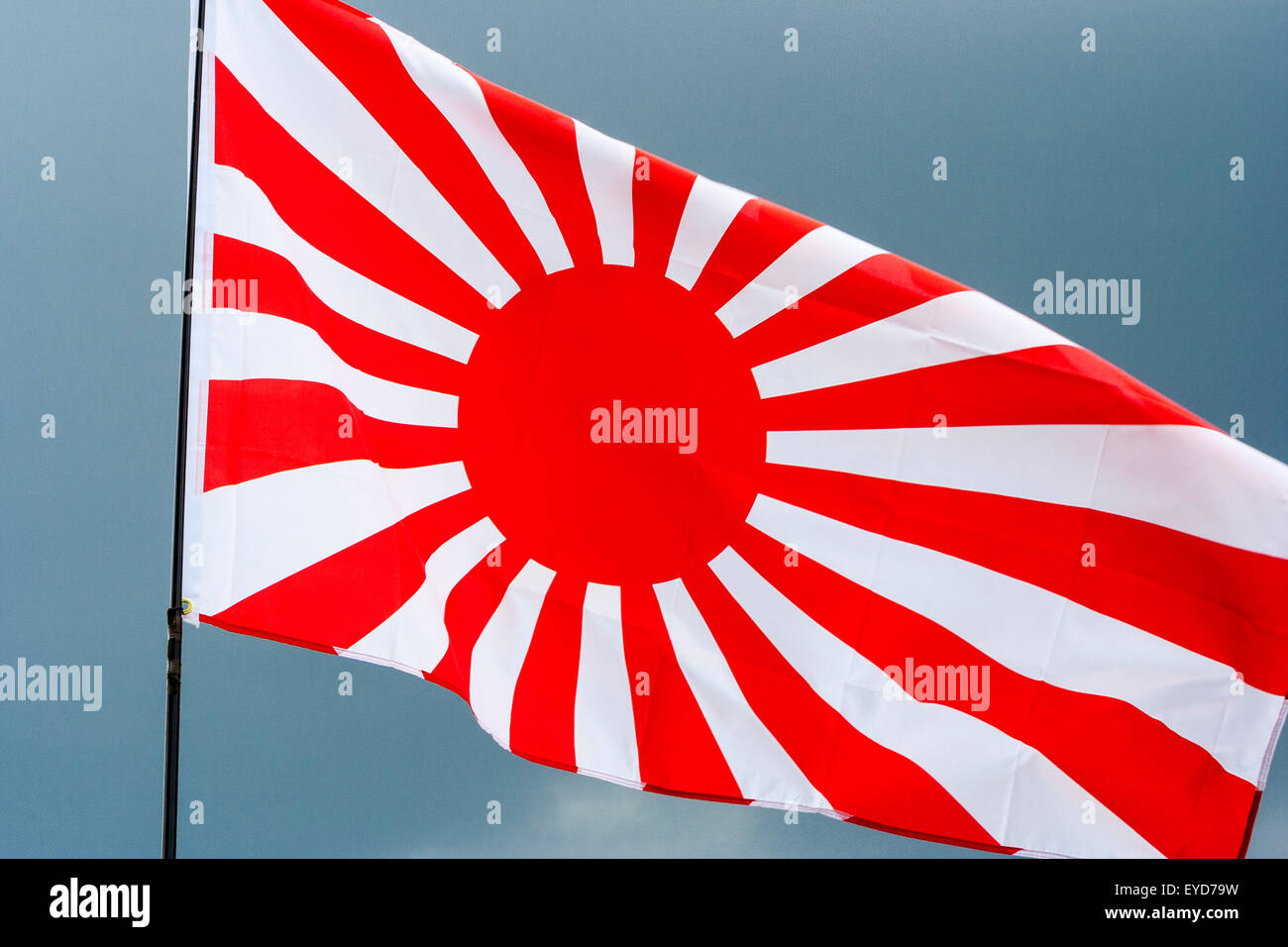 Japanese Rising Sun Flag Kyokujitsu Ki Nisshōki Or Hinomaru Used By The Military In Second World War Dark Storm Clouds Gathering In Background Stock Photo Alamy