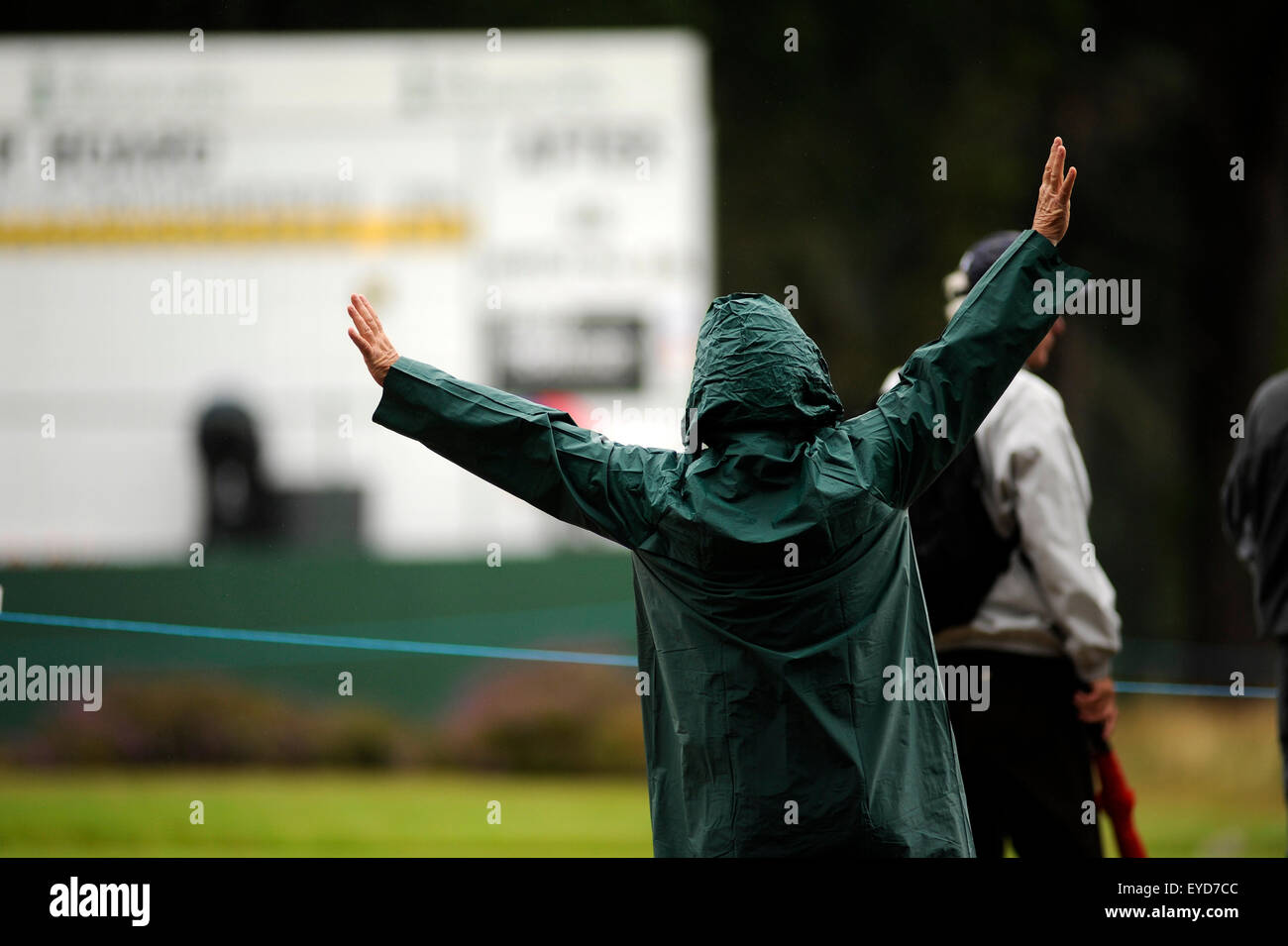 Sunningdale, UK. 26th July, 2015. A marshal braves the elements during a wet final round at The Senior Open Championship at Sunningdale Golf Club on July 26, 2015 in Sunningdale, England. Credit:  David Partridge/Alamy Live News Stock Photo