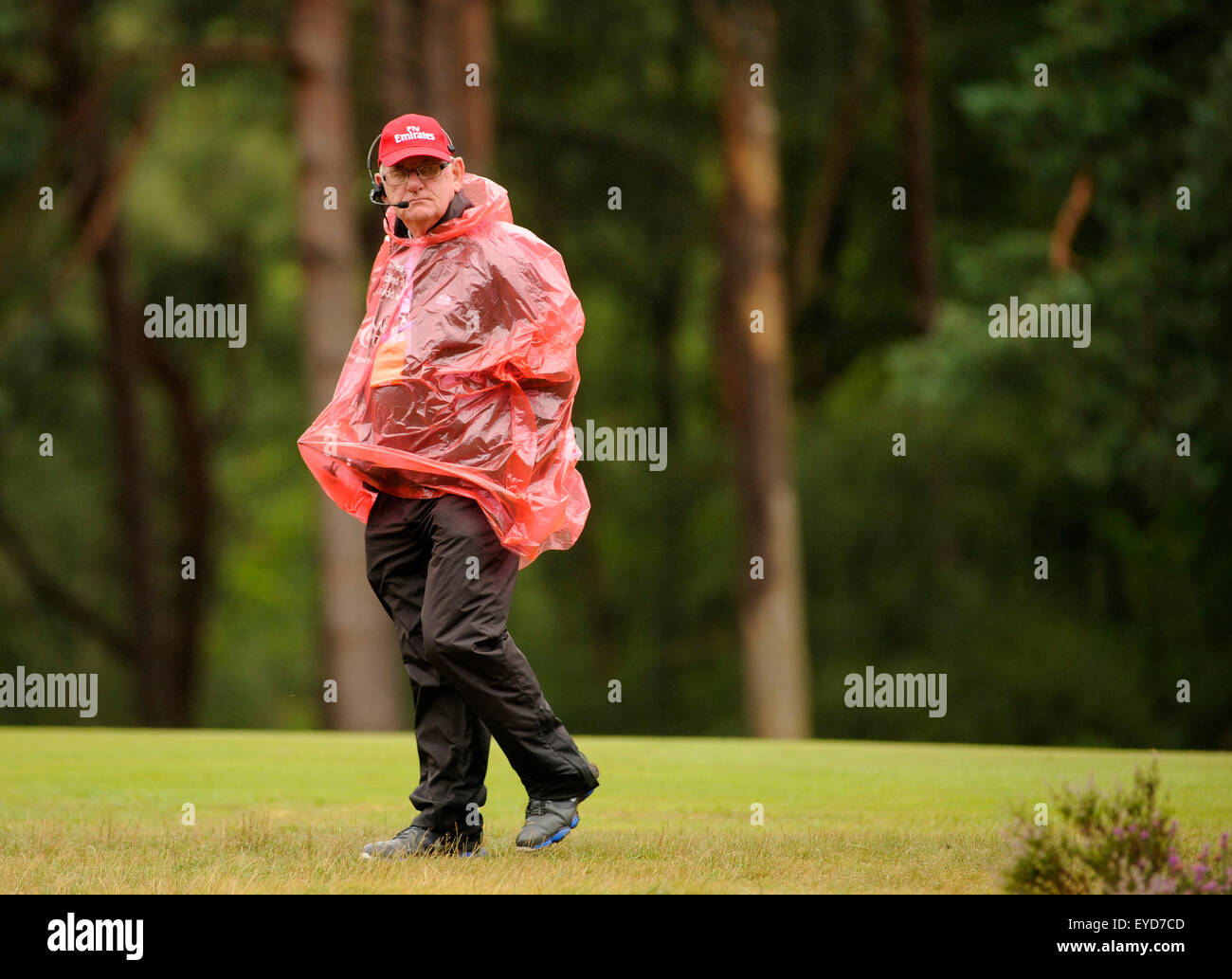 Sunningdale, UK. 26th July, 2015. A marshal braves the elements during a wet final round at The Senior Open Championship at Sunningdale Golf Club on July 26, 2015 in Sunningdale, England. Credit:  David Partridge/Alamy Live News Stock Photo
