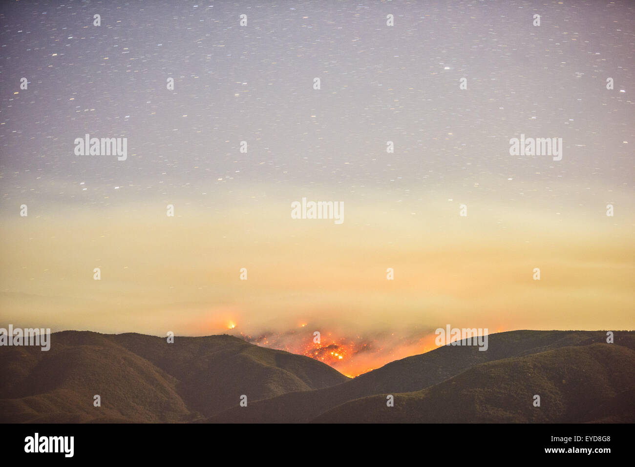 Aguanga, CA, USA. 24th July, 2015. The Cutca Fire burns at night in the Cleveland National Forest on Palomar Mountain Friday Night July 24, 2015. The fire was estimated at 200 acres and was 0% contained. The fire is burning in heavy fuels in remote terrain and crews were being flown in to battle the blaze overnight. The cause of the fire is suspected to be a holdover lightning strike that ignited. © Stuart Palley/ZUMA Wire/Alamy Live News Stock Photo