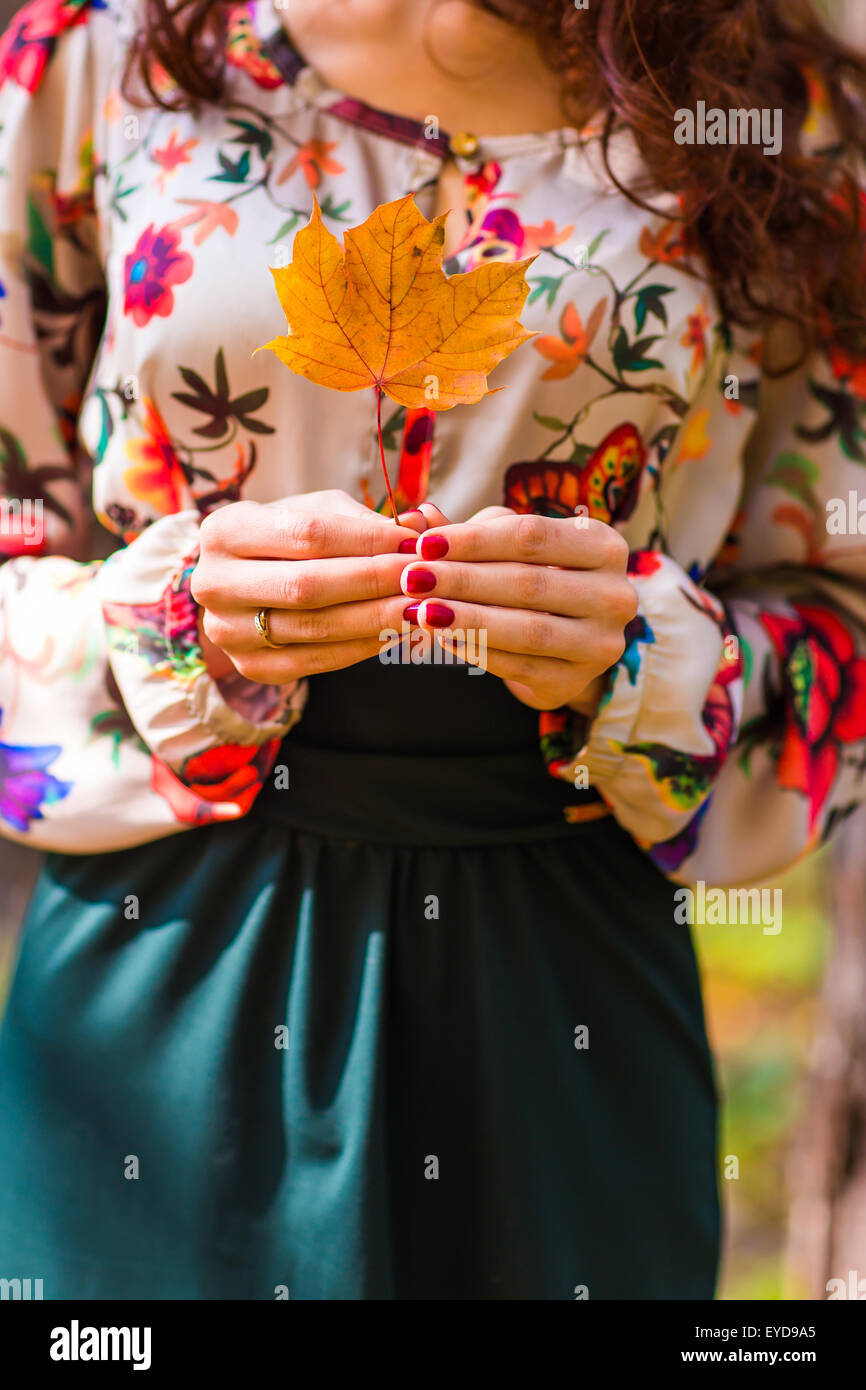 girl in autumn park with leaves Stock Photo - Alamy