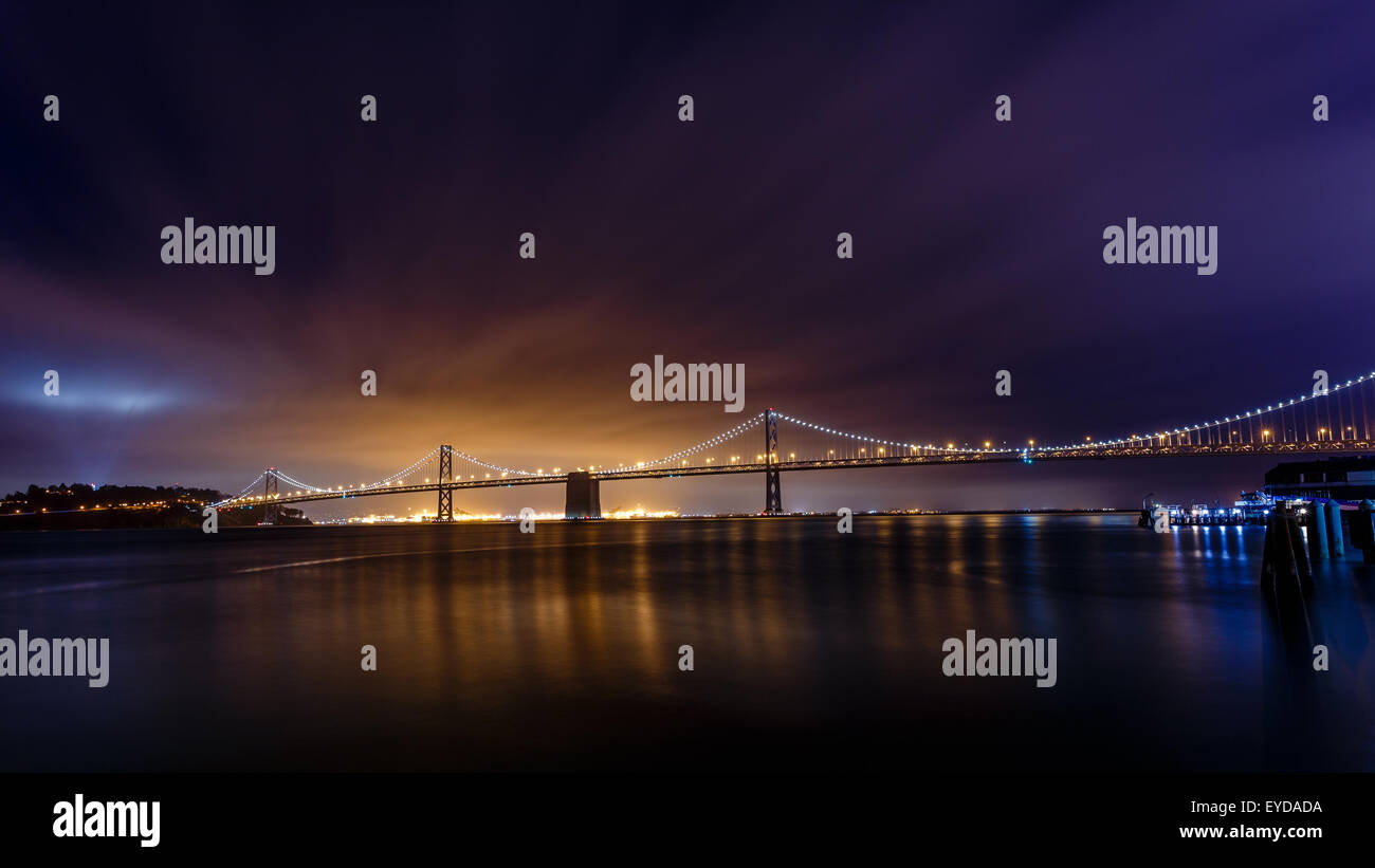 San Francisco-Oakland Bay Bridge illuminated at night in San Francisco, California, USA Stock Photo