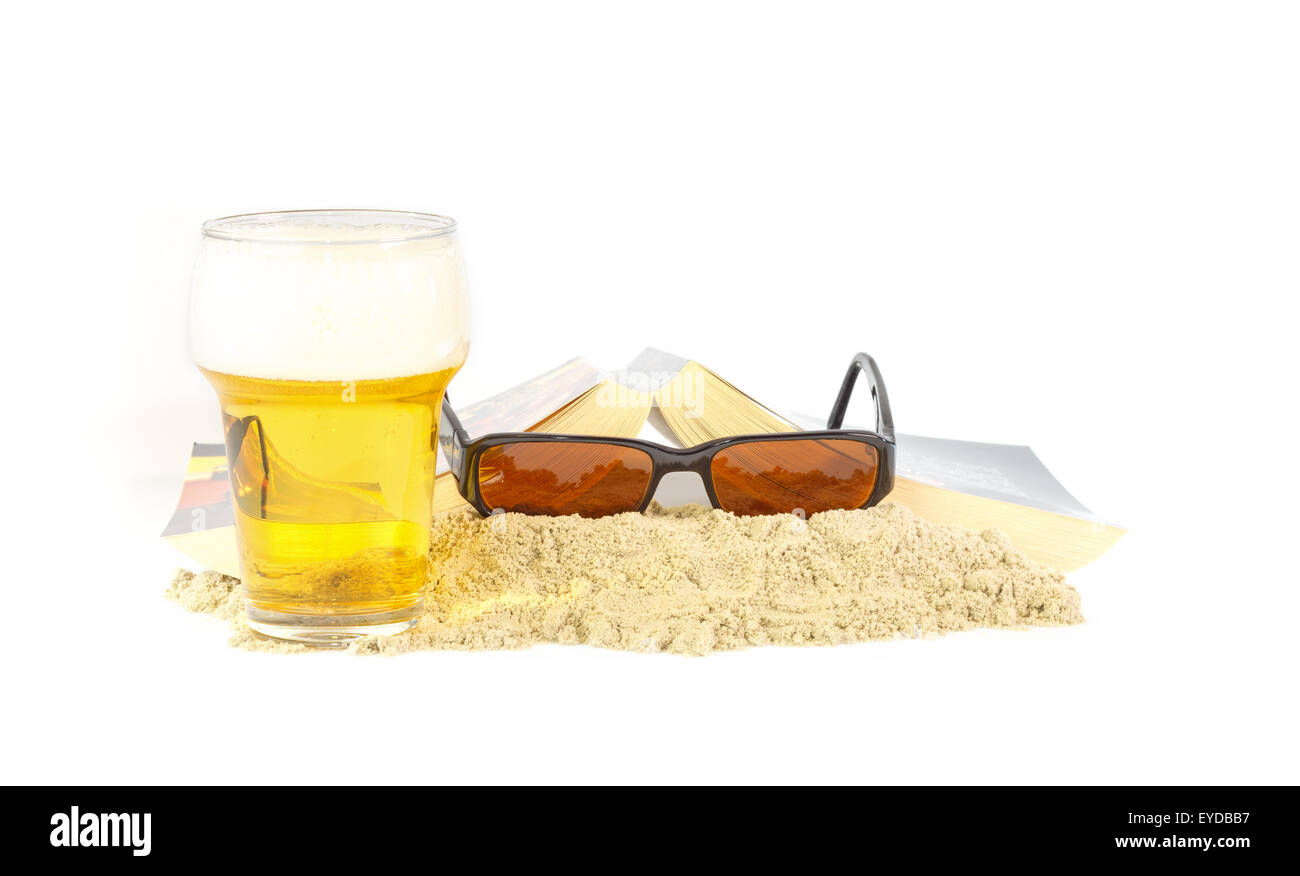 Leisure time on the beach with a good book and a beer Stock Photo