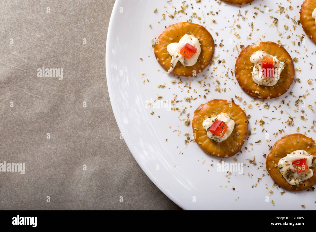 Cracker with Cream Cheese and red bell pepper Stock Photo
