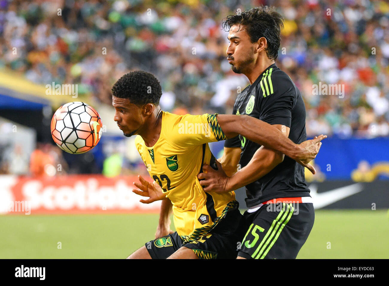 Philadelphia, Pennsylvania, USA. 26th July, 2015. Jamaica midfielder Garath McClearly #22 and Mexico defender Hector Moreno #15 battle for a loose ball during the 2015 CONCACAF Gold Cup final between Jamaica and Mexico at Lincoln Financial Field in Philadelphia, Pennsylvania. Mexico defeated Jamaica 3-1. Rich Barnes/CSM/Alamy Live News Stock Photo