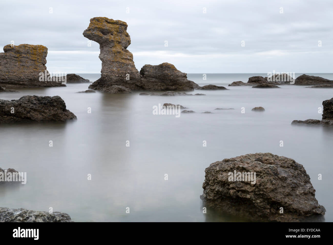 Sea Stack by Ocean in Gotland, Sweden with clouds in the sky. Stock Photo