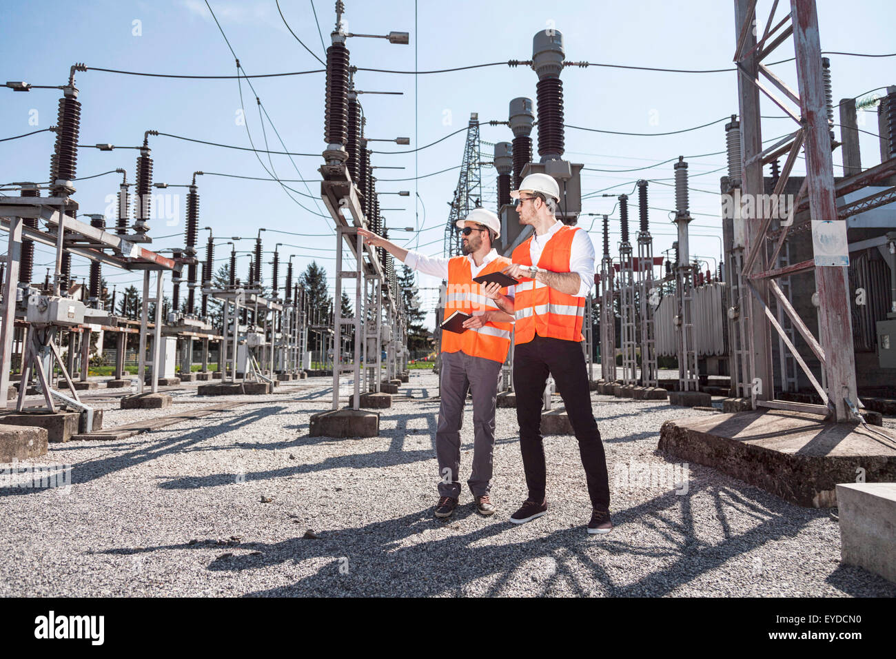 Engineers checking electricity substation Stock Photo - Alamy