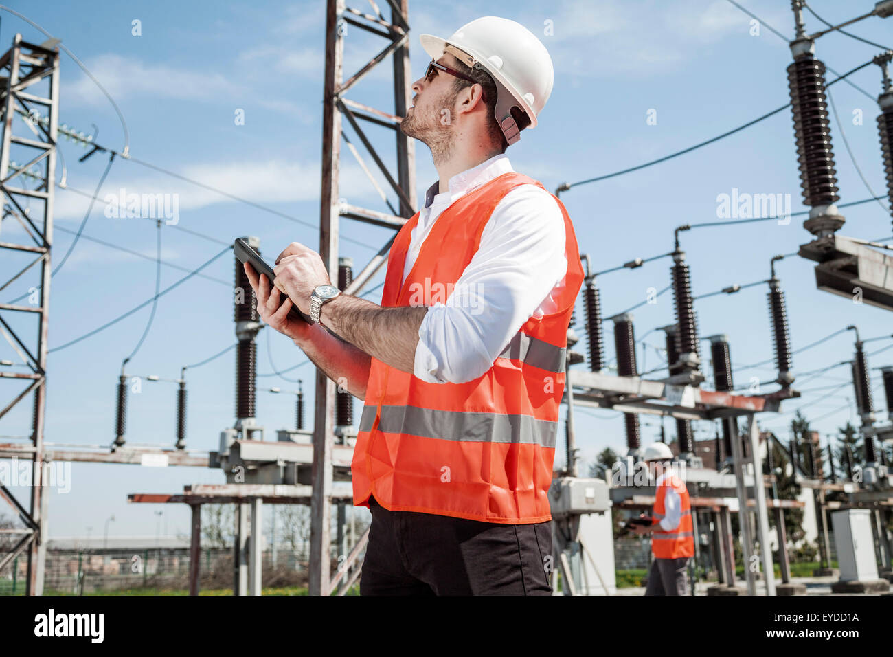 Engineers checking electricity substation Stock Photo - Alamy
