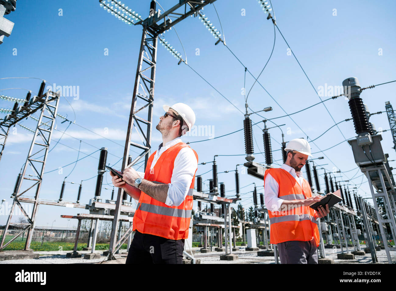 Engineers checking electricity substation Stock Photo