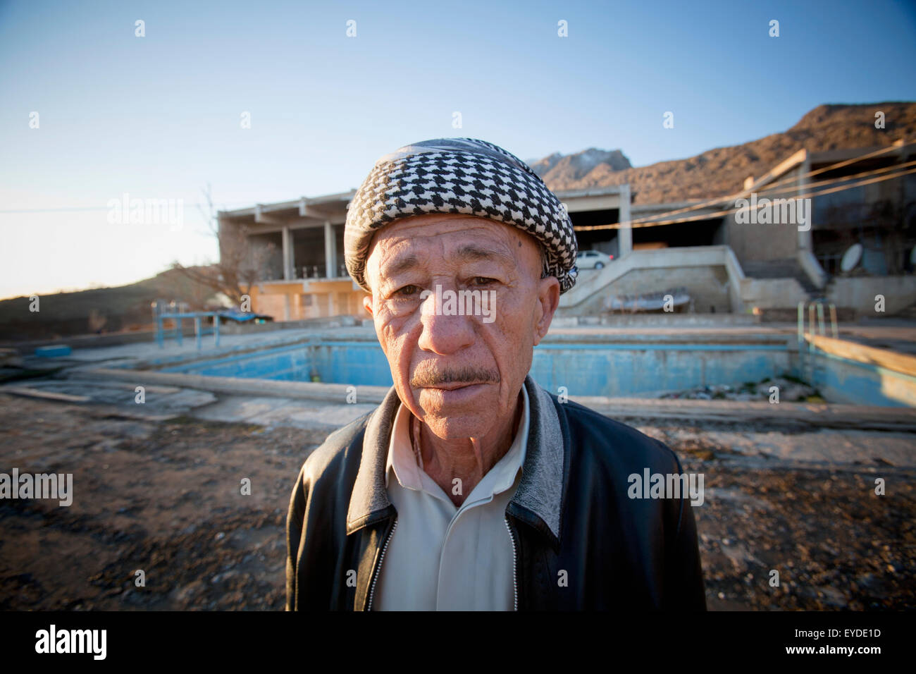 Close-Up Of A Senior Man With Squatted Building Outside Amadiya In Iraqi Kurdistan, Iraq Stock Photo