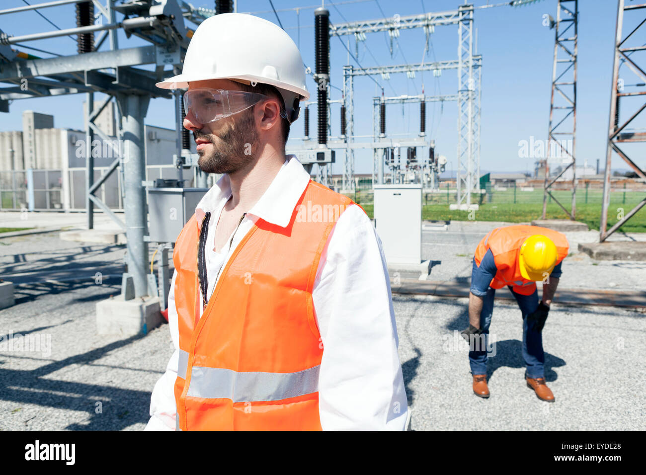 Two engineers checking electricity substation Stock Photo