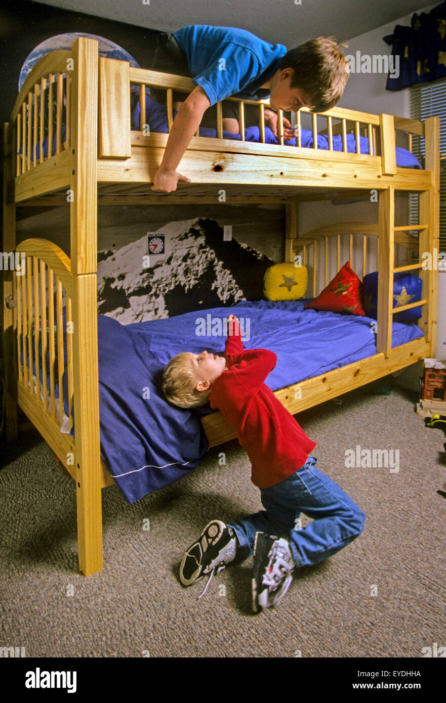 Two brothers play on their bunk beds at home in Corona, CA Stock Photo
