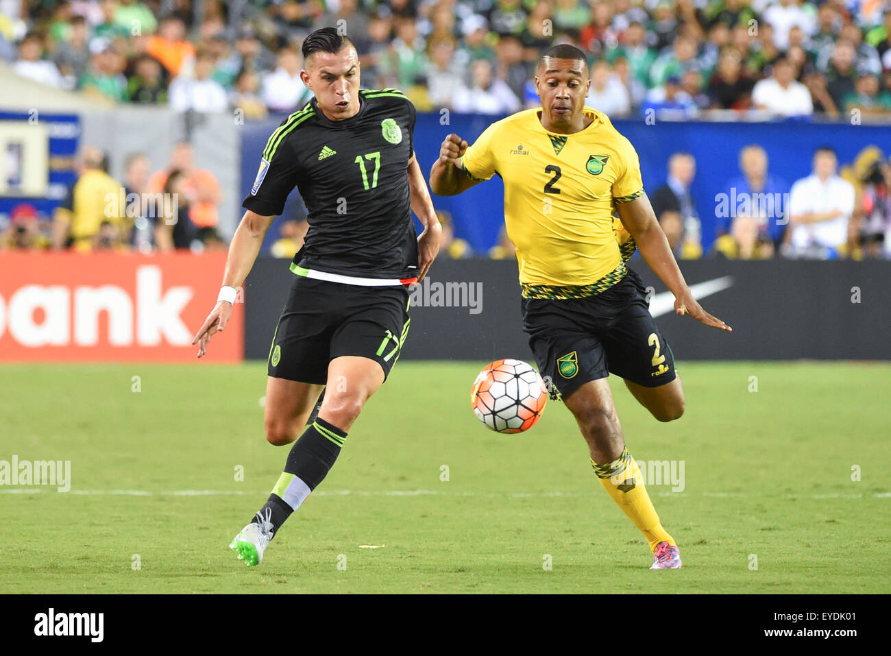 Philadelphia, Pennsylvania, USA. 26th July, 2015. Mexico midfielder Jorge Torres Nilo #17 and Jamaica midfielder Christopher Humphrey #2 chase after a loose ball during the 2015 CONCACAF Gold Cup final between Jamaica and Mexico at Lincoln Financial Field in Philadelphia, Pennsylvania. Mexico defeated Jamaica 3-1. Rich Barnes/CSM/Alamy Live News Stock Photo