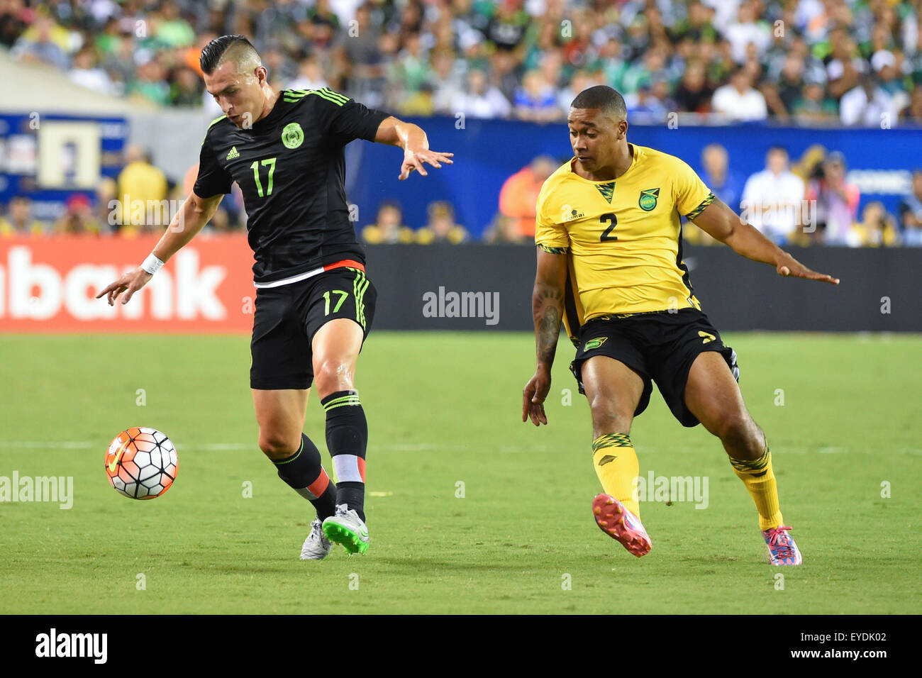 Philadelphia, Pennsylvania, USA. 26th July, 2015. Mexico midfielder Jorge Torres Nilo #17 and Jamaica midfielder Christopher Humphrey #2 chase after a loose ball during the 2015 CONCACAF Gold Cup final between Jamaica and Mexico at Lincoln Financial Field in Philadelphia, Pennsylvania. Mexico defeated Jamaica 3-1. Rich Barnes/CSM/Alamy Live News Stock Photo