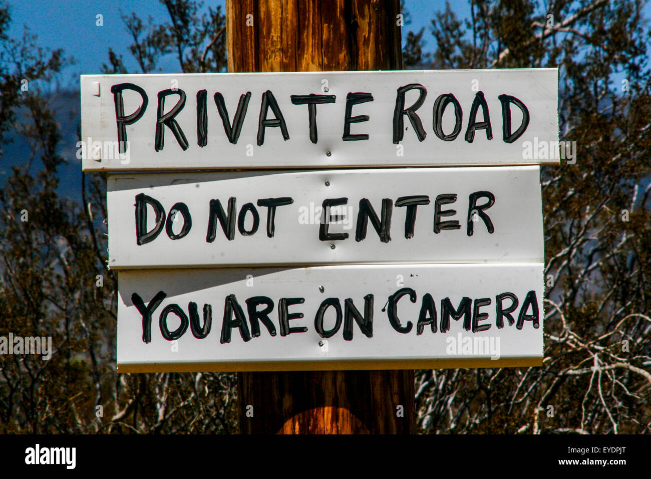 Sign  on private ranch road , Mojave Desert, California Stock Photo