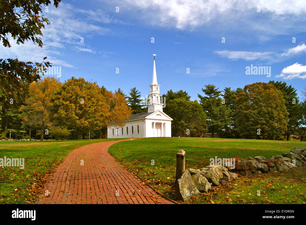 A white clapboard New England chapel on a sunny day in Fall Stock Photo