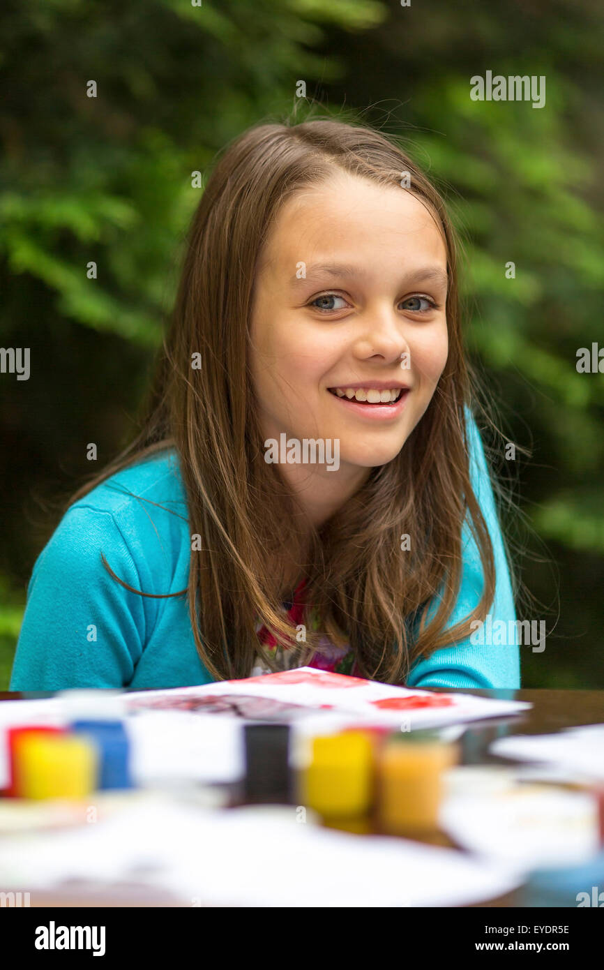 Portrait of little girl during painting paints Stock Photo - Alamy