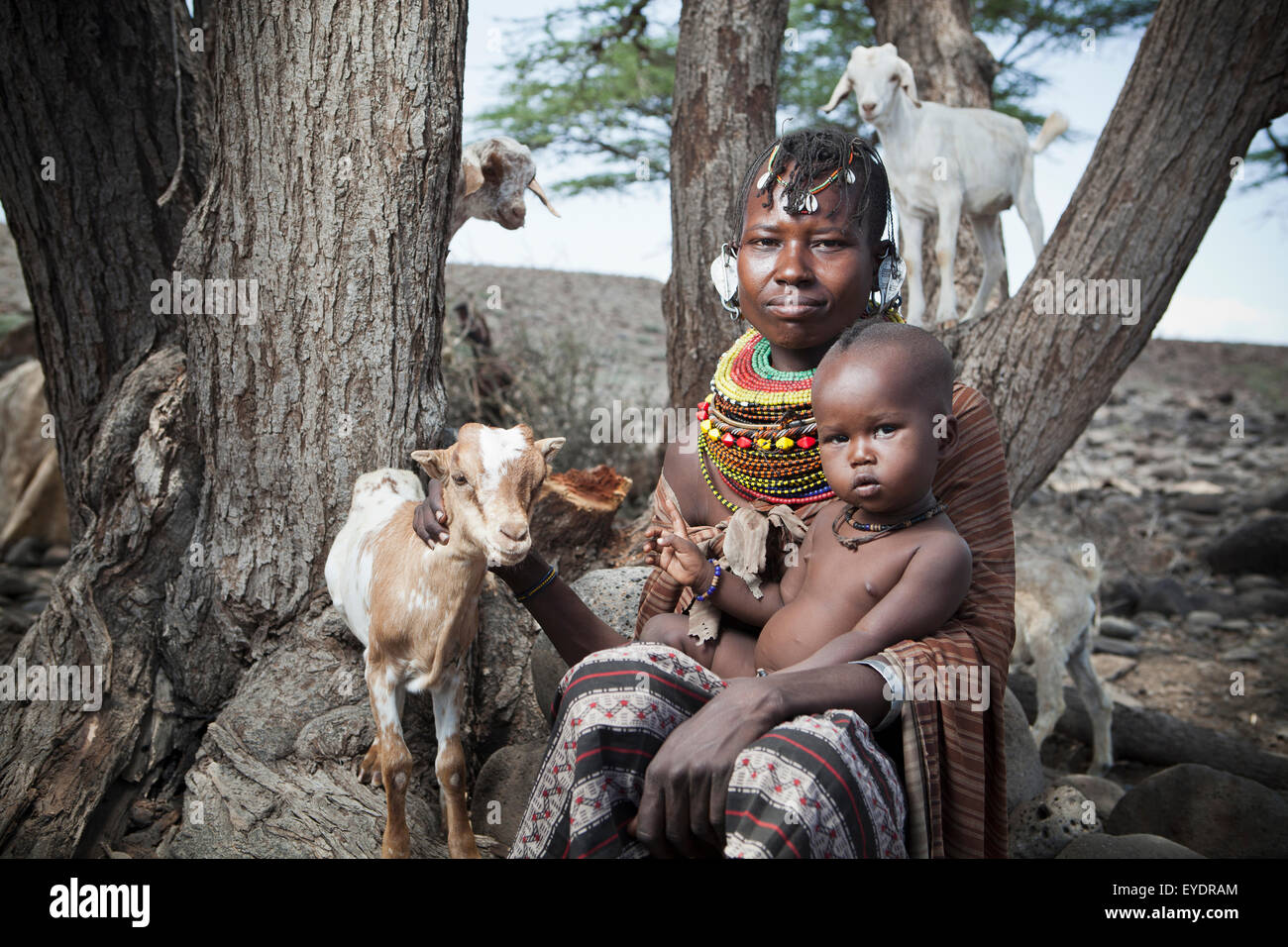 Kenya, Portrait of traditionally dressed Turkana woman and child on Lake Turkana; Loyangalani Stock Photo