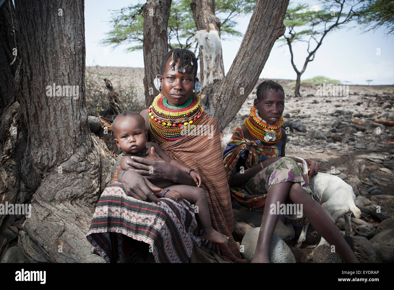 Kenya, Portrait of traditionally dressed Turkana women and child on Lake Turkana; Loyangalani Stock Photo