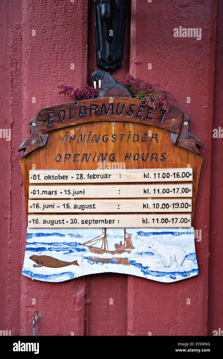 Museum Operating Hours Sign Detail of the opening hours sign outside the Polar Museum; Tromso ...