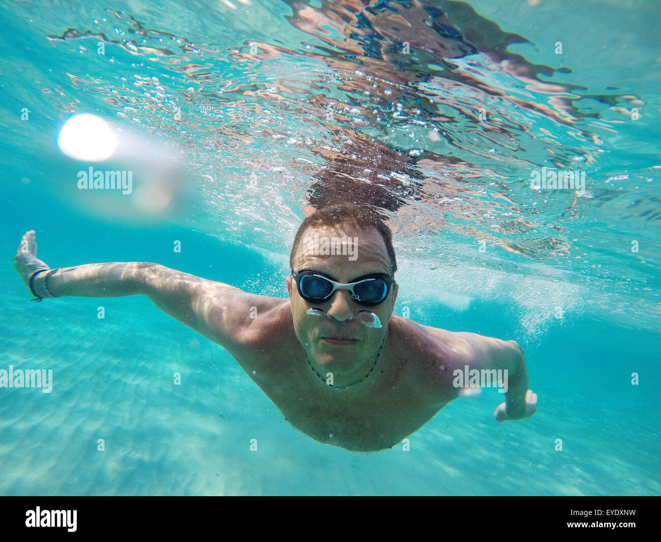 Swimming under the water in a clear sea Stock Photo