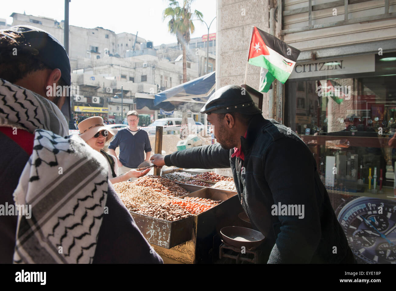 street-nut-roasting-vendor-serving-tourists-warm-roasted-nuts-amman