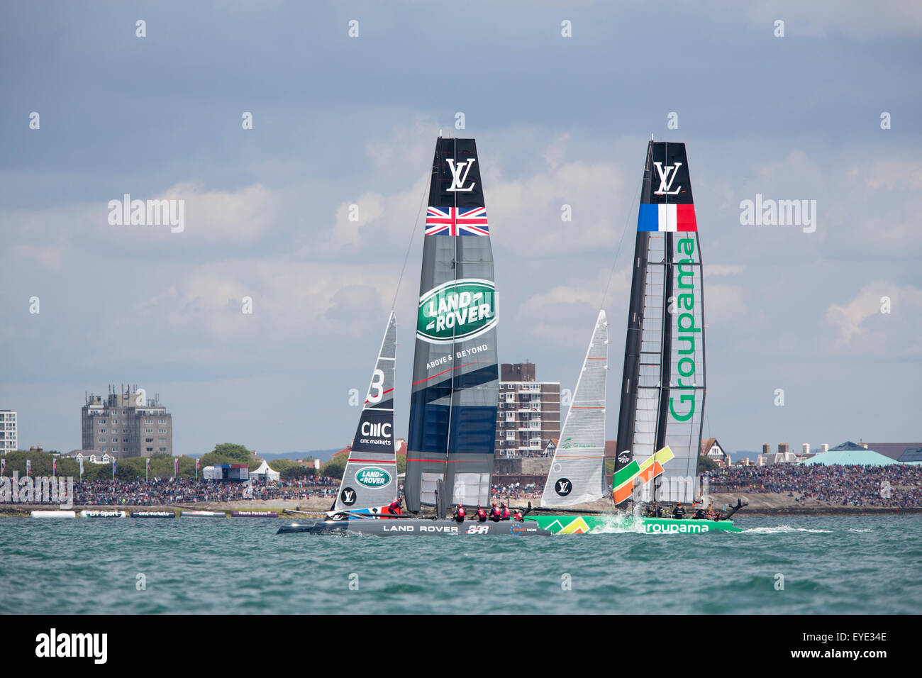 America's Cup World Series event in Portsmouth UK with AC45 foiling yachts racing close inshore off Southsea Common. Stock Photo