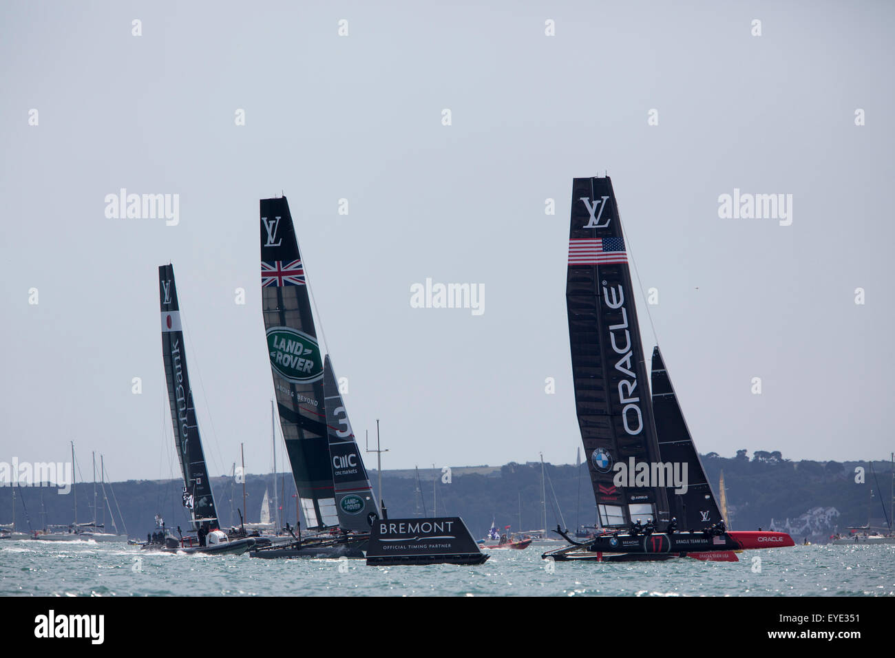 America's Cup World Series event in Portsmouth UK with AC45 foiling yachts racing close inshore off Southsea Common. Stock Photo