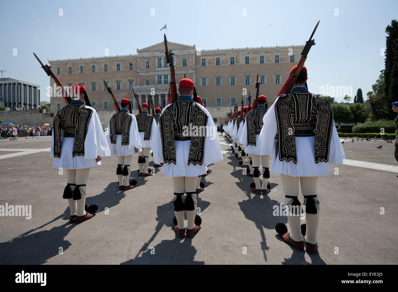 Evzones infantry standing at attention during a ceremonial event attended by tourist crowds in central Athens, Syntagma, Greece. Stock Photo