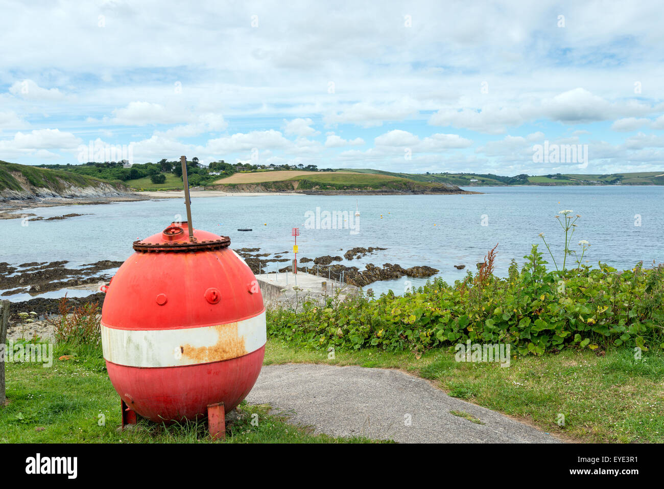 An old buoy above the harbour at Portscatho on the Cornish coast Stock Photo