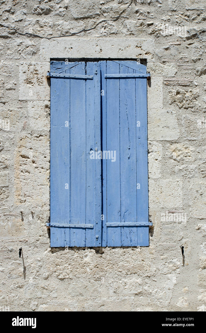 Closed wooden shutters in a stone wall Stock Photo - Alamy