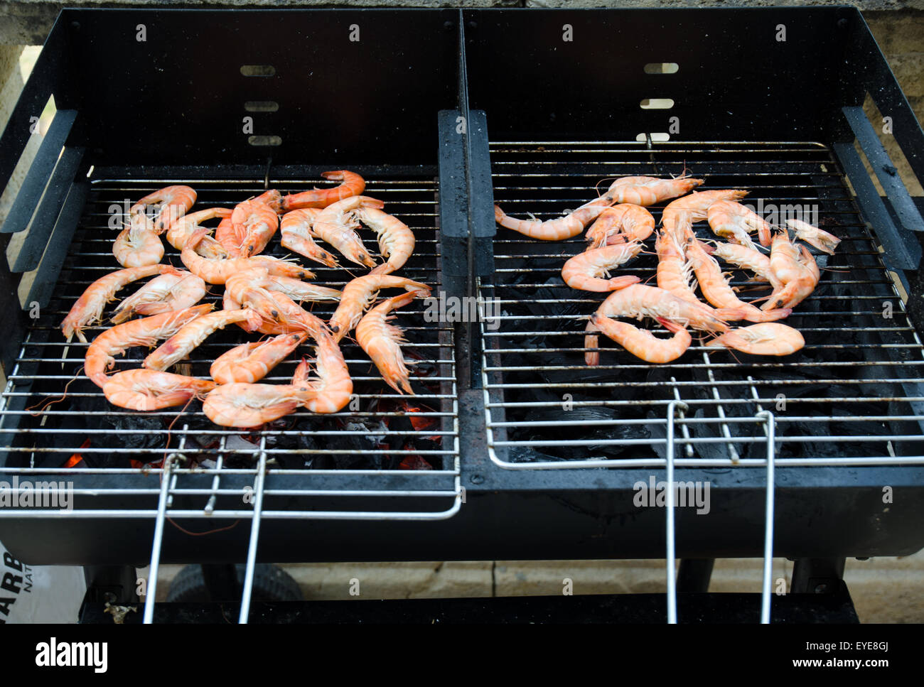 Prawns cooking on a BBQ Stock Photo Alamy