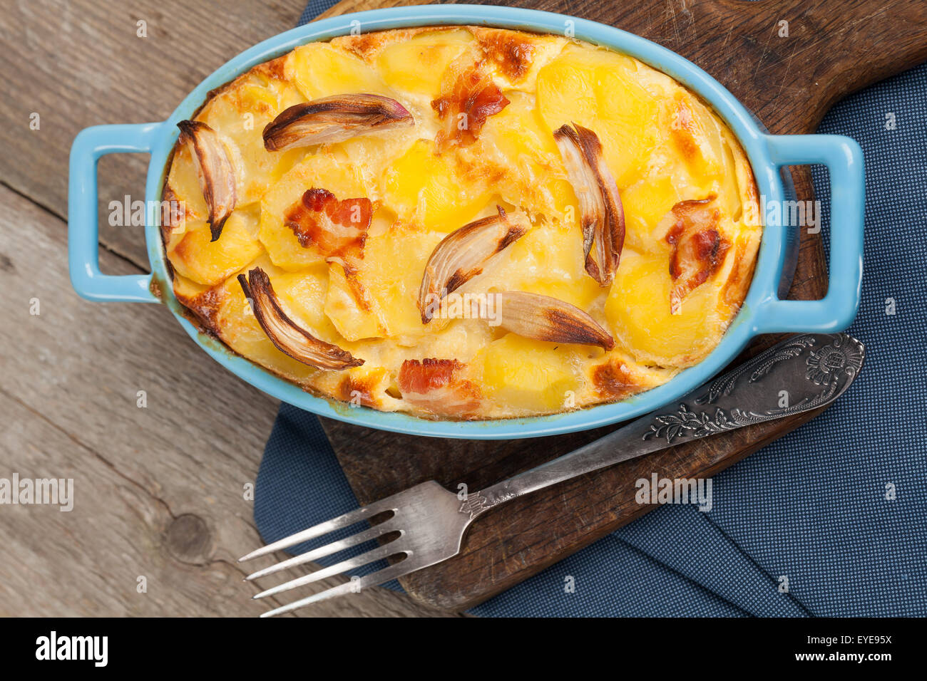 Potato casserole with bacon, parmesan cheese, onion and eggs. Stock Photo
