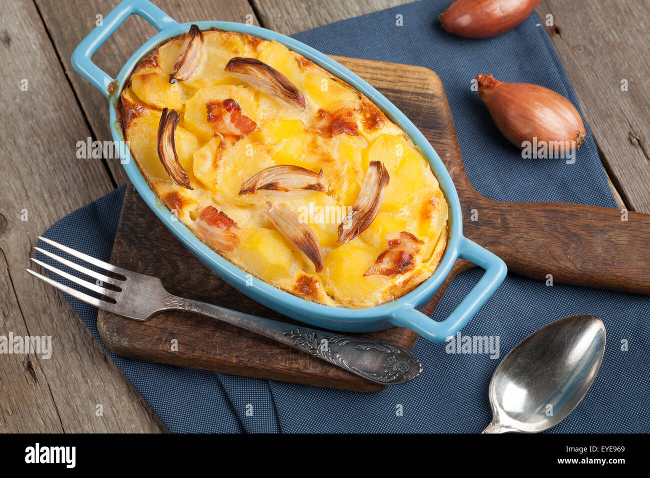Potato casserole with bacon, onion, parmesan cheese. Stock Photo
